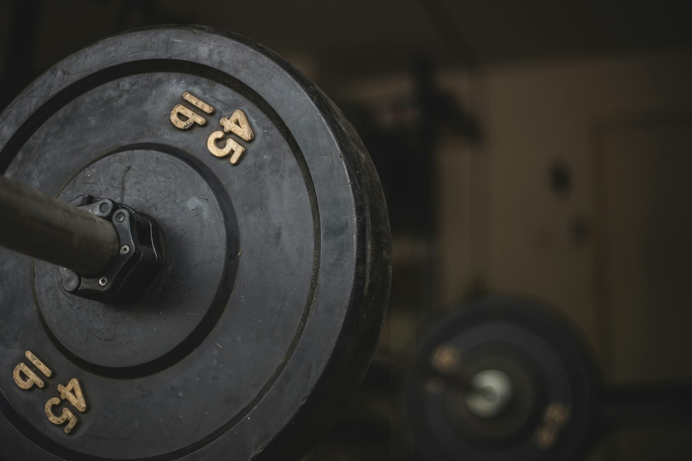 Close view of a forty-five pound plate on a barbell